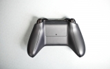 <p>The controller still takes AA batteries, but the humplike compartment is gone. So are the screwholes. <p>The controller still takes AA batteries, but the humplike compartment is gone. So are the screwholes.